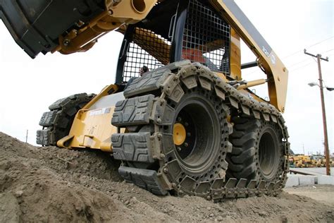 skid steer track vs wheels|skid steer tires clearance.